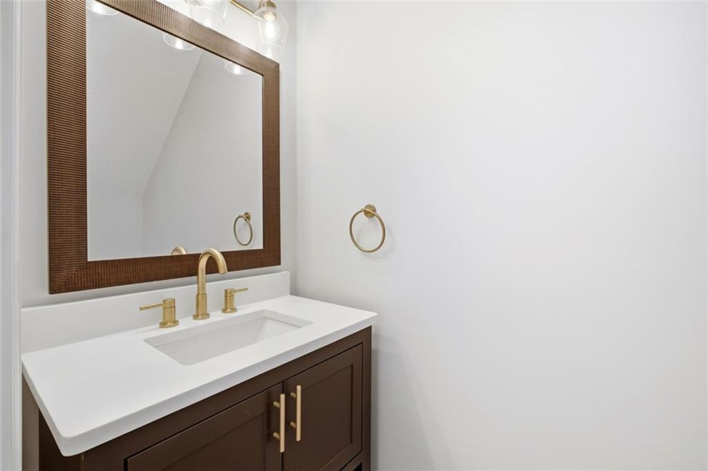 5764 Reps Trace Norcross, GA 30071 - Photo 17 of 32 a bathroom with a sink and a mirror