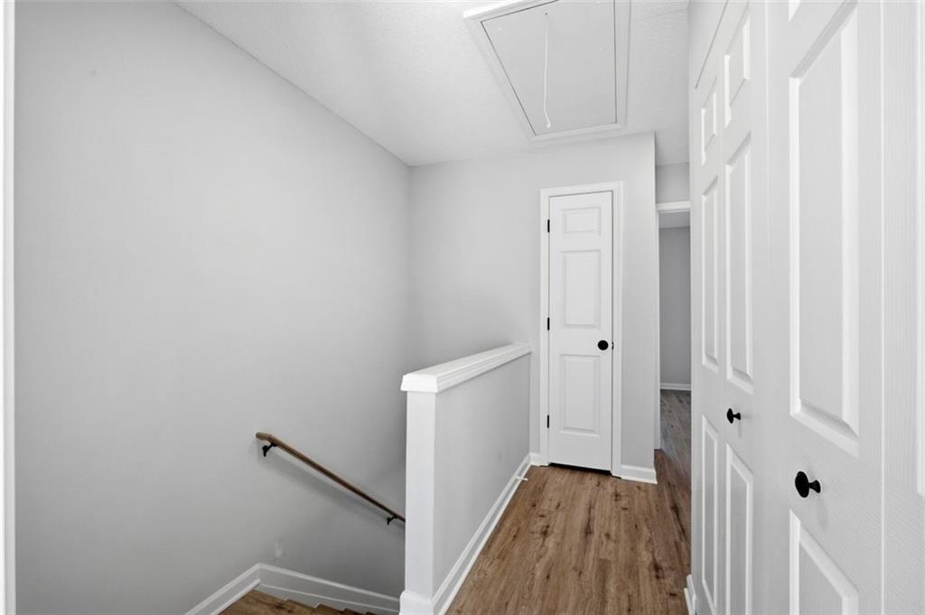 5764 Reps Trace Norcross, GA 30071 - Photo 18 of 32 a view of a hallway with wooden floor