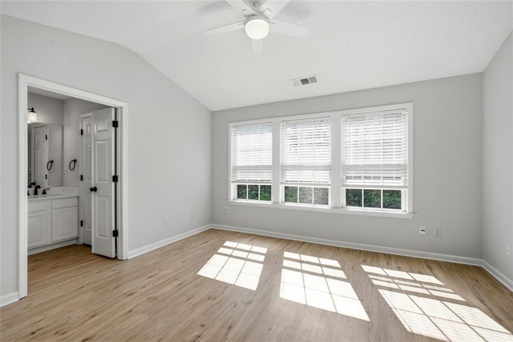 5764 Reps Trace Norcross, GA 30071 - Photo 20 of 32 a view of an empty room with wooden floor and a window