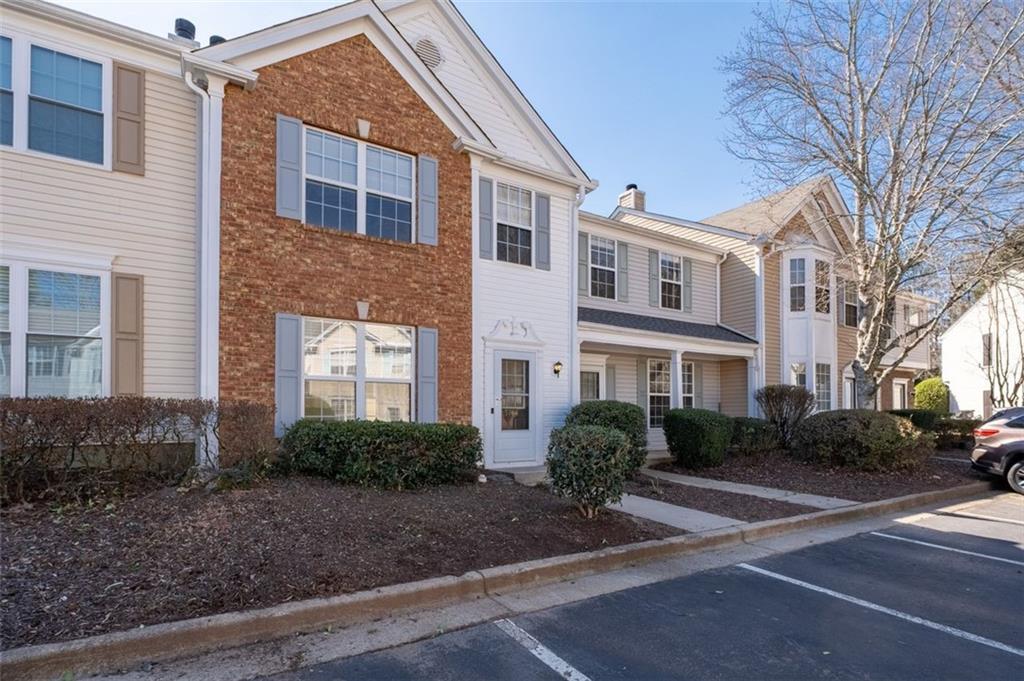 5764 Reps Trace Norcross, GA 30071 - Photo 2 of 32 a front view of a house with garden