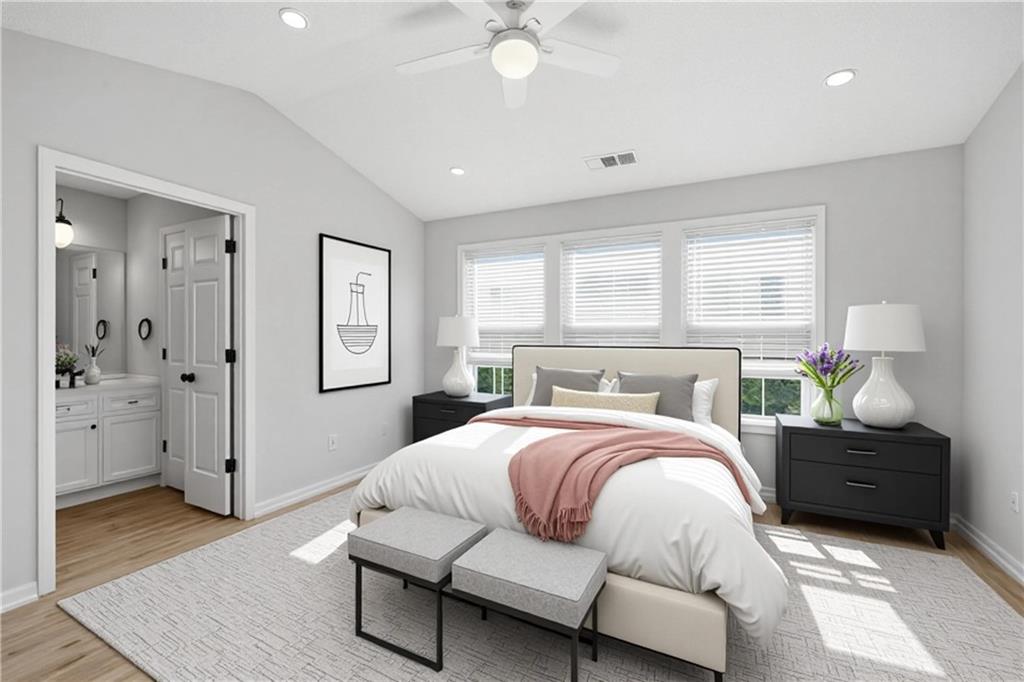 5764 Reps Trace Norcross, GA 30071 - Photo 21 of 32 a bedroom with a bed and a chandelier