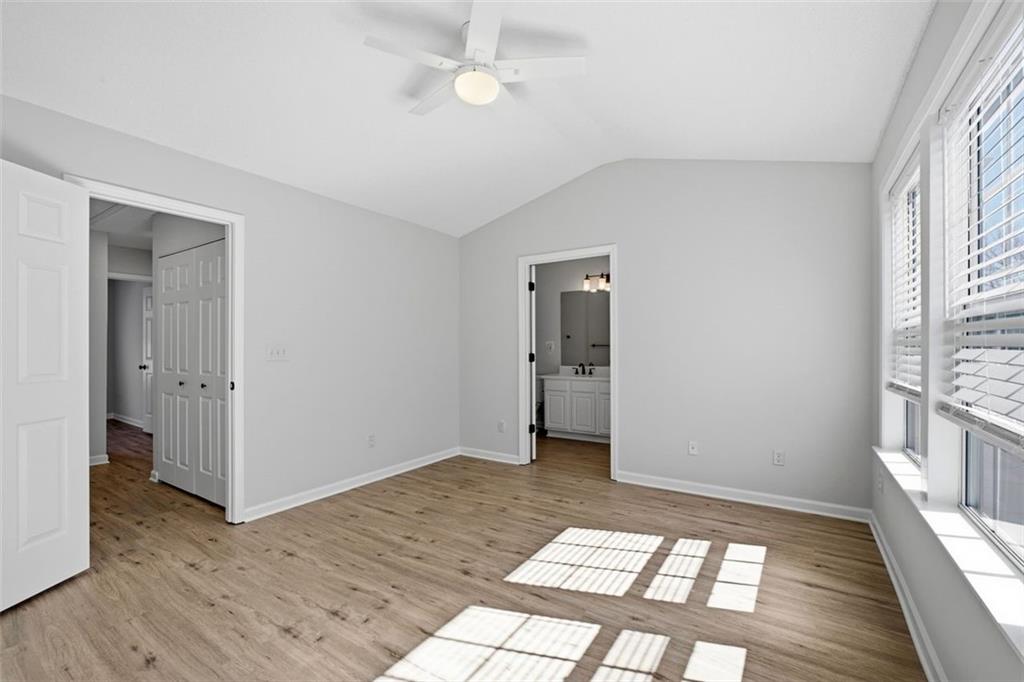 5764 Reps Trace Norcross, GA 30071 - Photo 22 of 32 a view of an empty room with a window and wooden floor