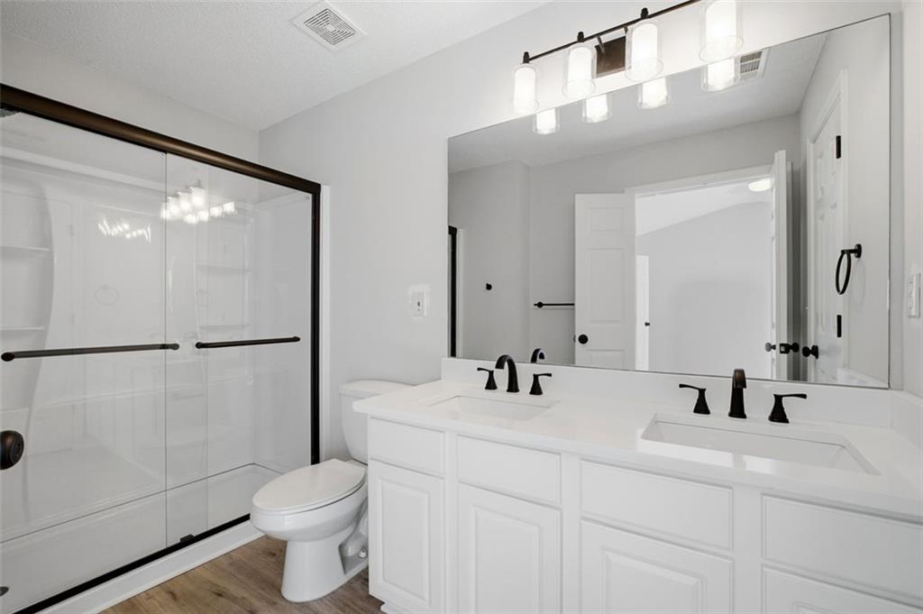 5764 Reps Trace Norcross, GA 30071 - Photo 23 of 32 a bathroom with a sink toilet and shower