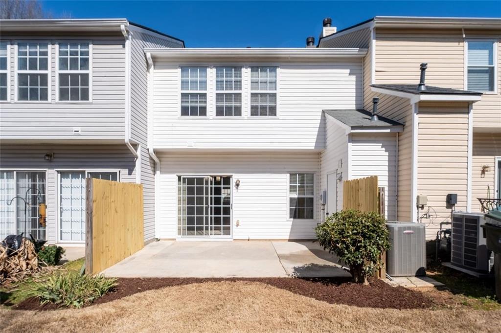 5764 Reps Trace Norcross, GA 30071 - Photo 31 of 32 a front view of a house with a yard and a garage