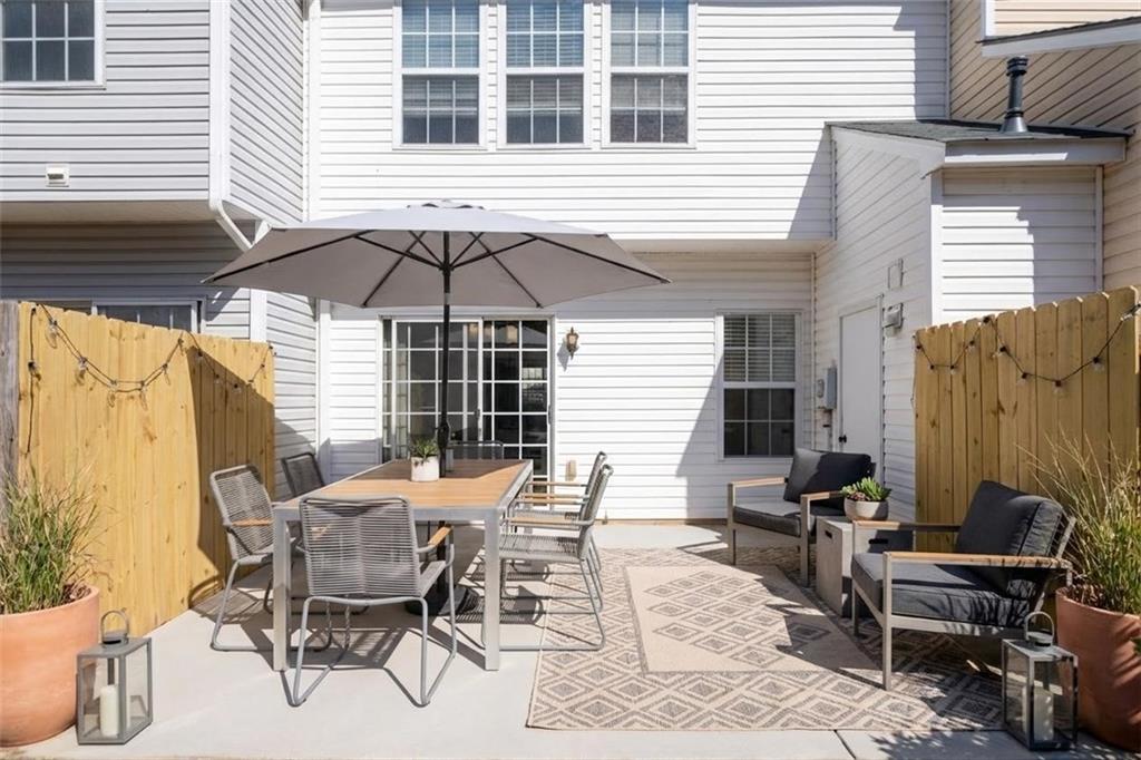 5764 Reps Trace Norcross, GA 30071 - Photo 32 of 32 a view of a dinning table and chairs in the patio