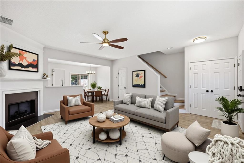 5764 Reps Trace Norcross, GA 30071 - Photo 5 of 32 a living room with furniture a fireplace and a flat screen tv