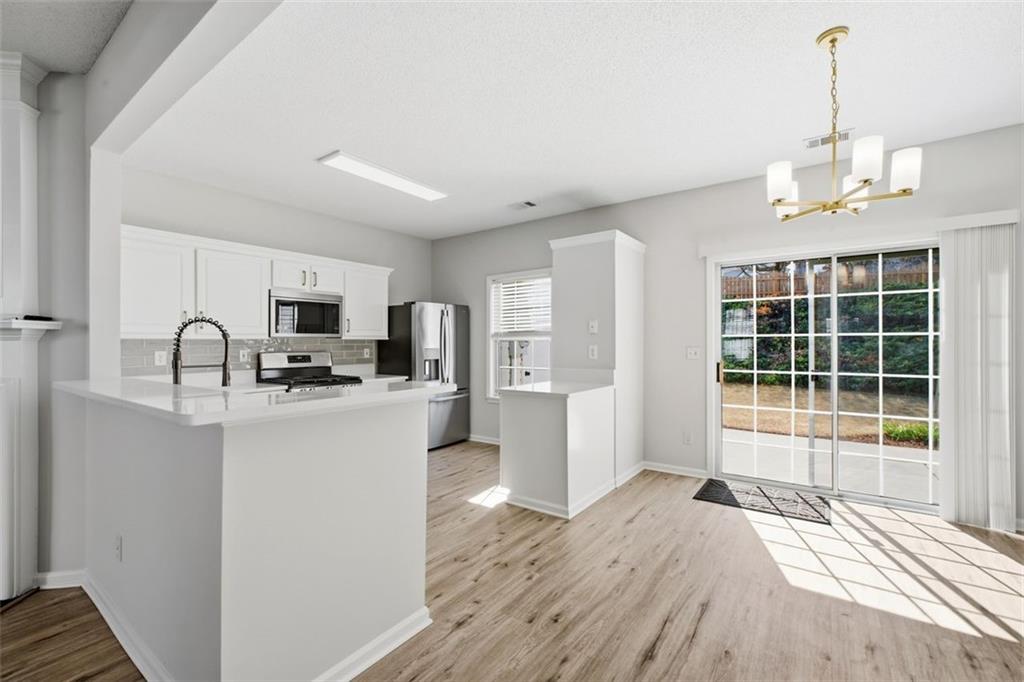 5764 Reps Trace Norcross, GA 30071 - Photo 9 of 32 a view of a kitchen with sink and microwave