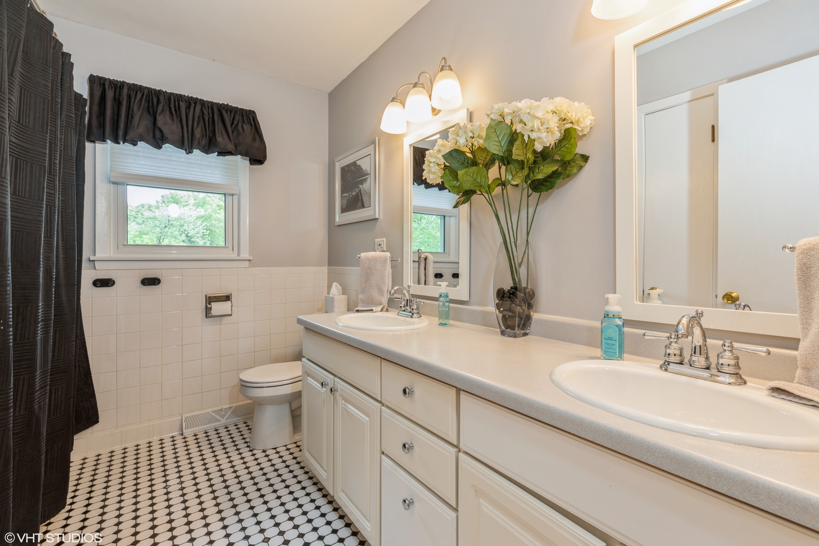 2235 Maple Road Homewood, IL 60430 - Photo 14 of 21 a bathroom with a sink a toilet and a mirror