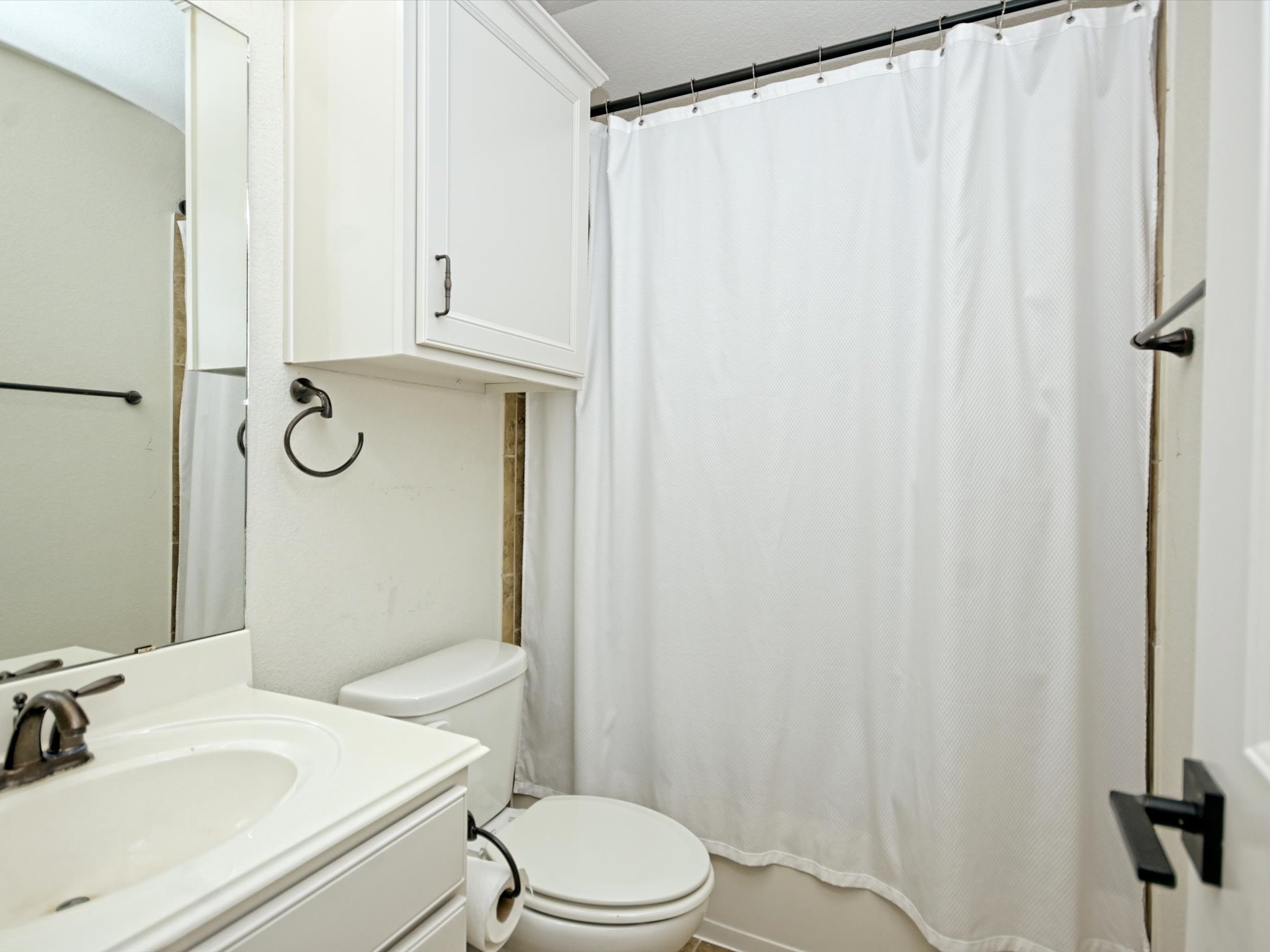 201 Bellagio Drive Austin, TX 78734 - Photo 25 of 31 The 3rd full bath is located upstairs and comes with a shower/tub combo.
