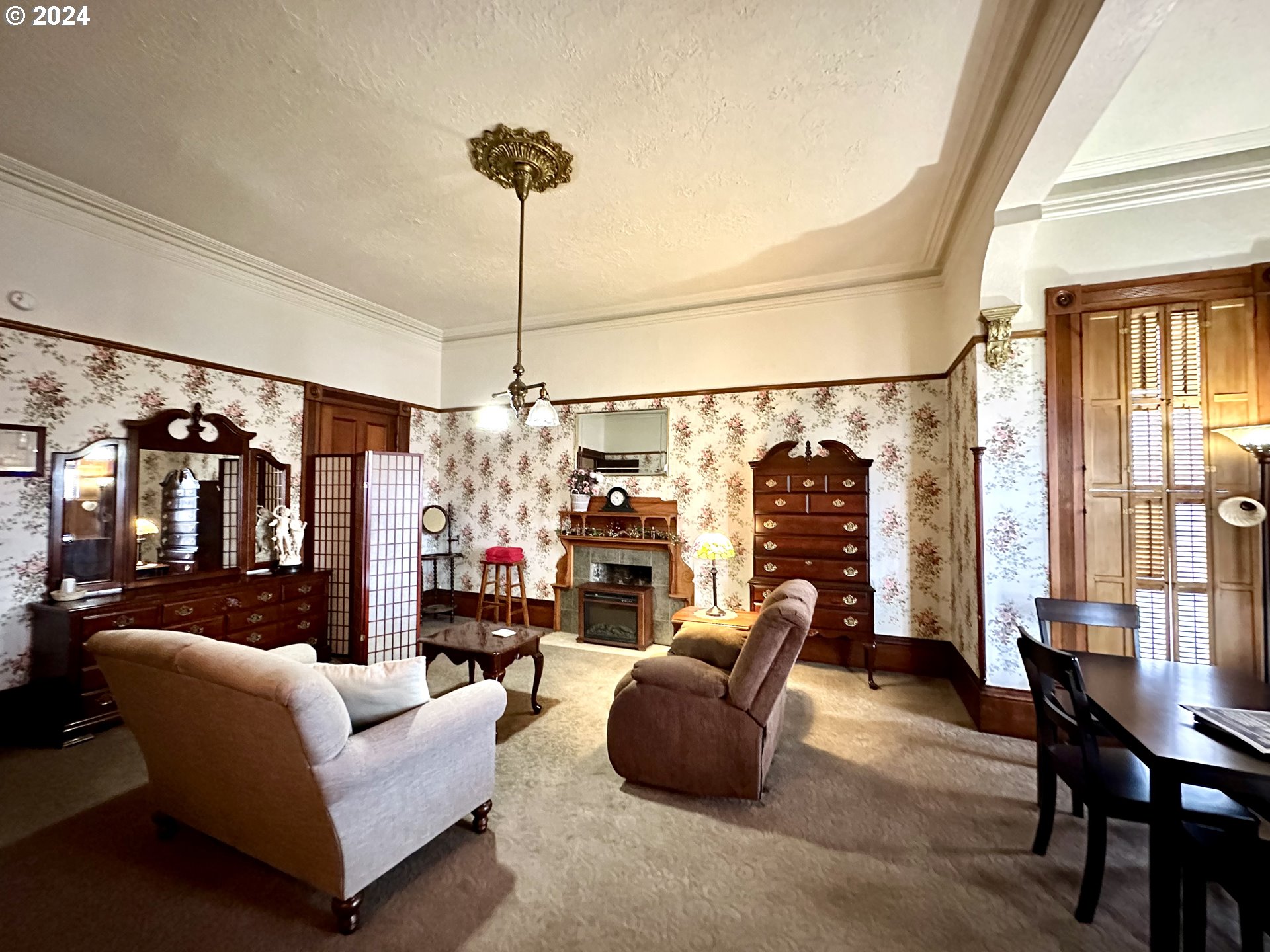 1790 Washington Avenue Baker City, OR 97814 - Photo 14 of 42 a living room with furniture fireplace and flat screen tv