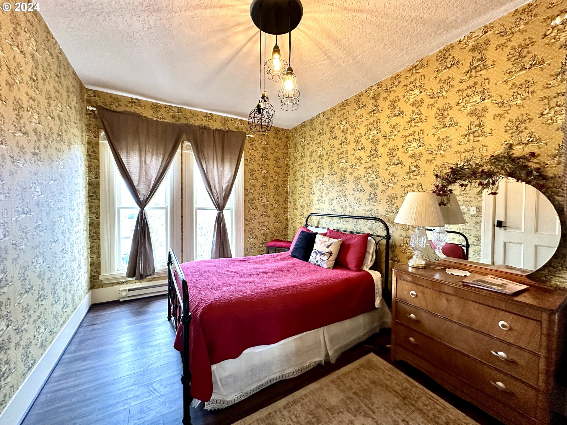 1790 Washington Avenue Baker City, OR 97814 - Photo 19 of 42 a bedroom with a bed dresser and a window
