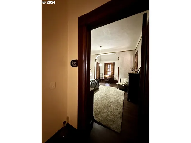 a bedroom with furniture and a chandelier