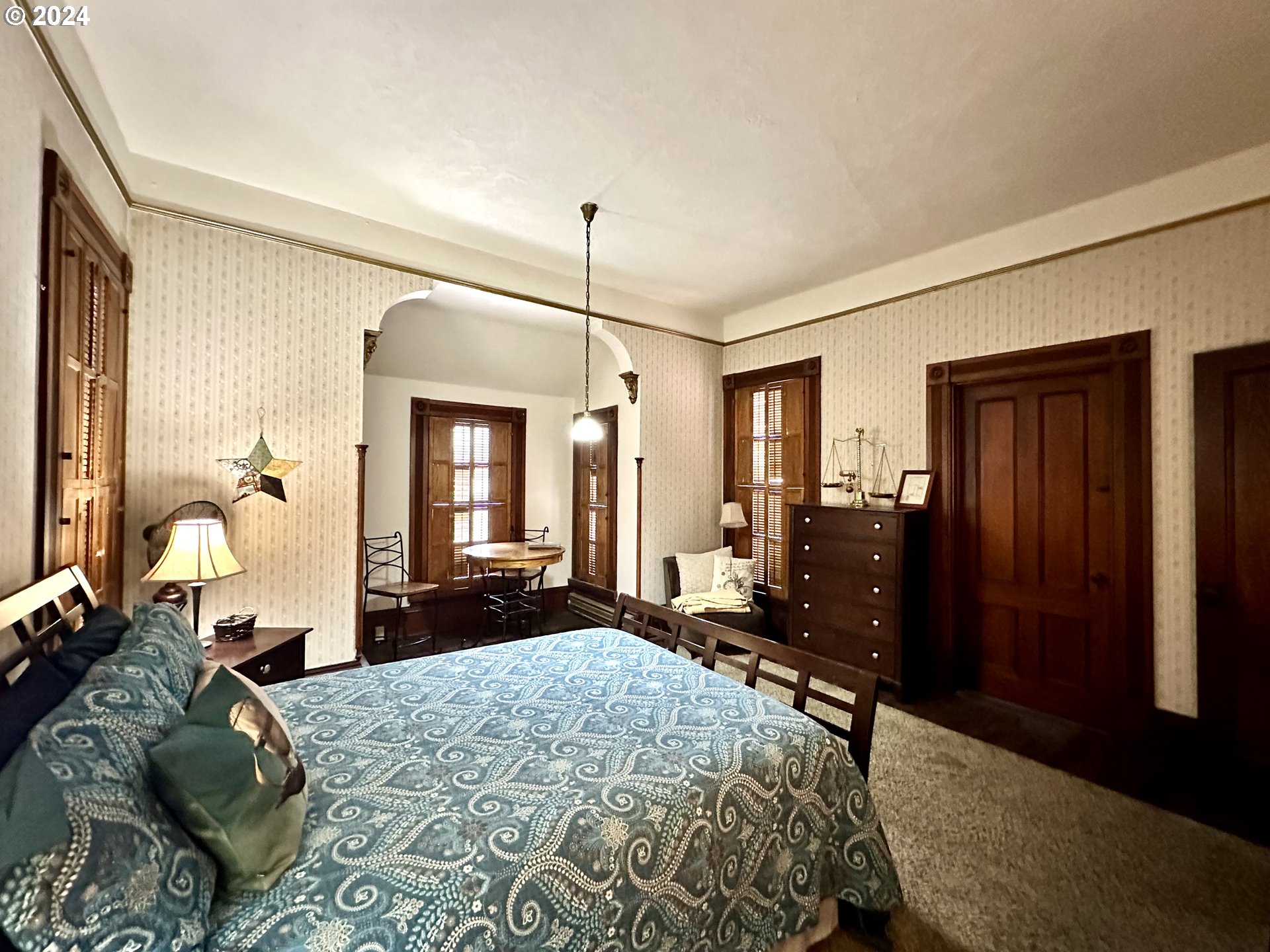 1790 Washington Avenue Baker City, OR 97814 - Photo 27 of 42 a bedroom with a bed dresser and windows