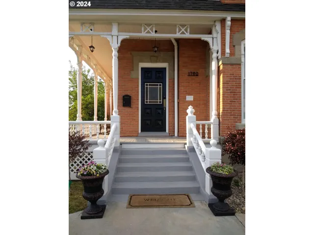 a view of staircase with a rug