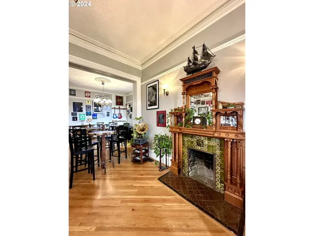 a living room with lots of furniture and fireplace
