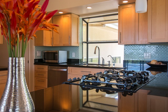 60 Oili Road Haiku, HI 96708 - Photo 12 of 30 a kitchen with a sink and a stove top oven