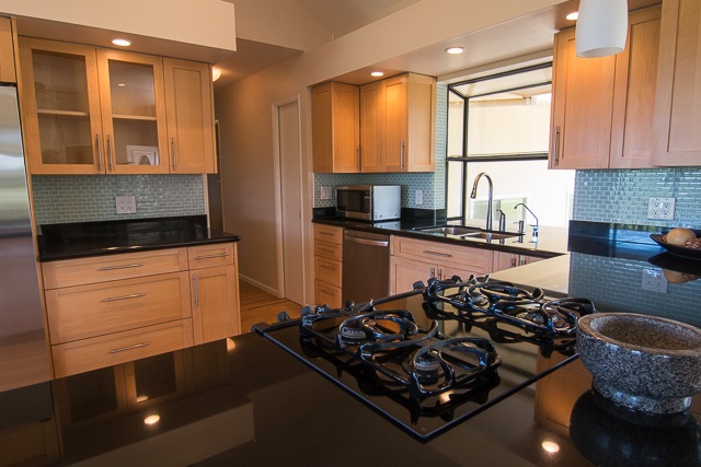 60 Oili Road Haiku, HI 96708 - Photo 13 of 30 a kitchen with a stove a sink and a microwave