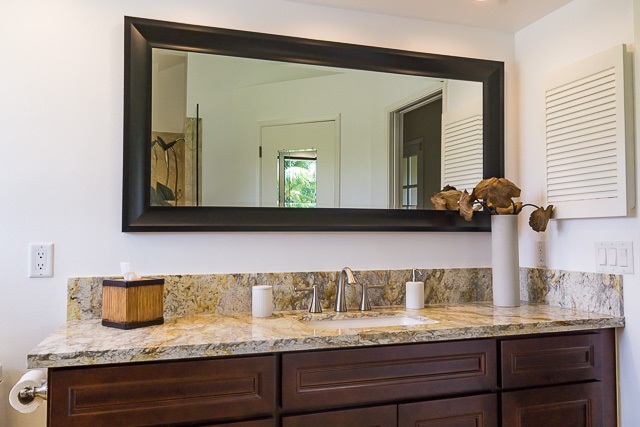 60 Oili Road Haiku, HI 96708 - Photo 16 of 30 a bathroom with a granite countertop sink and a mirror