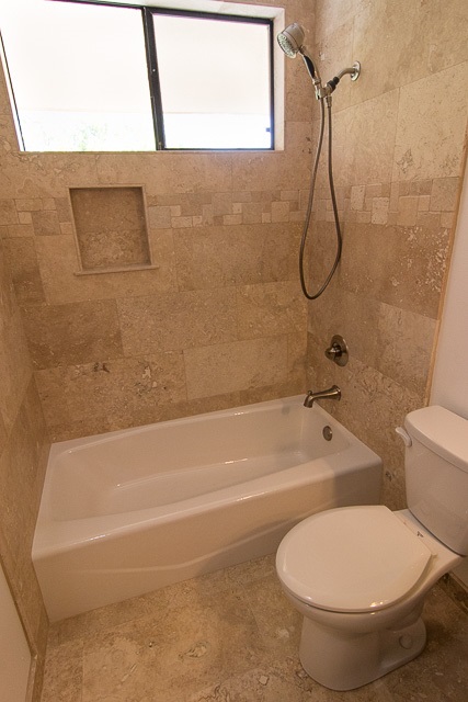 60 Oili Road Haiku, HI 96708 - Photo 21 of 30 a bathroom with a toilet and a bath tub