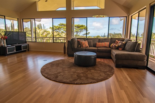 60 Oili Road Haiku, HI 96708 - Photo 8 of 30 a living room with furniture and a floor to ceiling window
