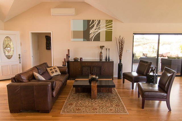 60 Oili Road Haiku, HI 96708 - Photo 9 of 30 a living room with furniture wooden floor and a table