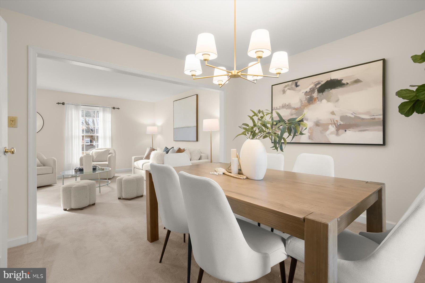 1727 Glastonberry Road Potomac, MD 20854 - Photo 12 of 45 a view of a dining room with furniture wooden floor and a chandelier