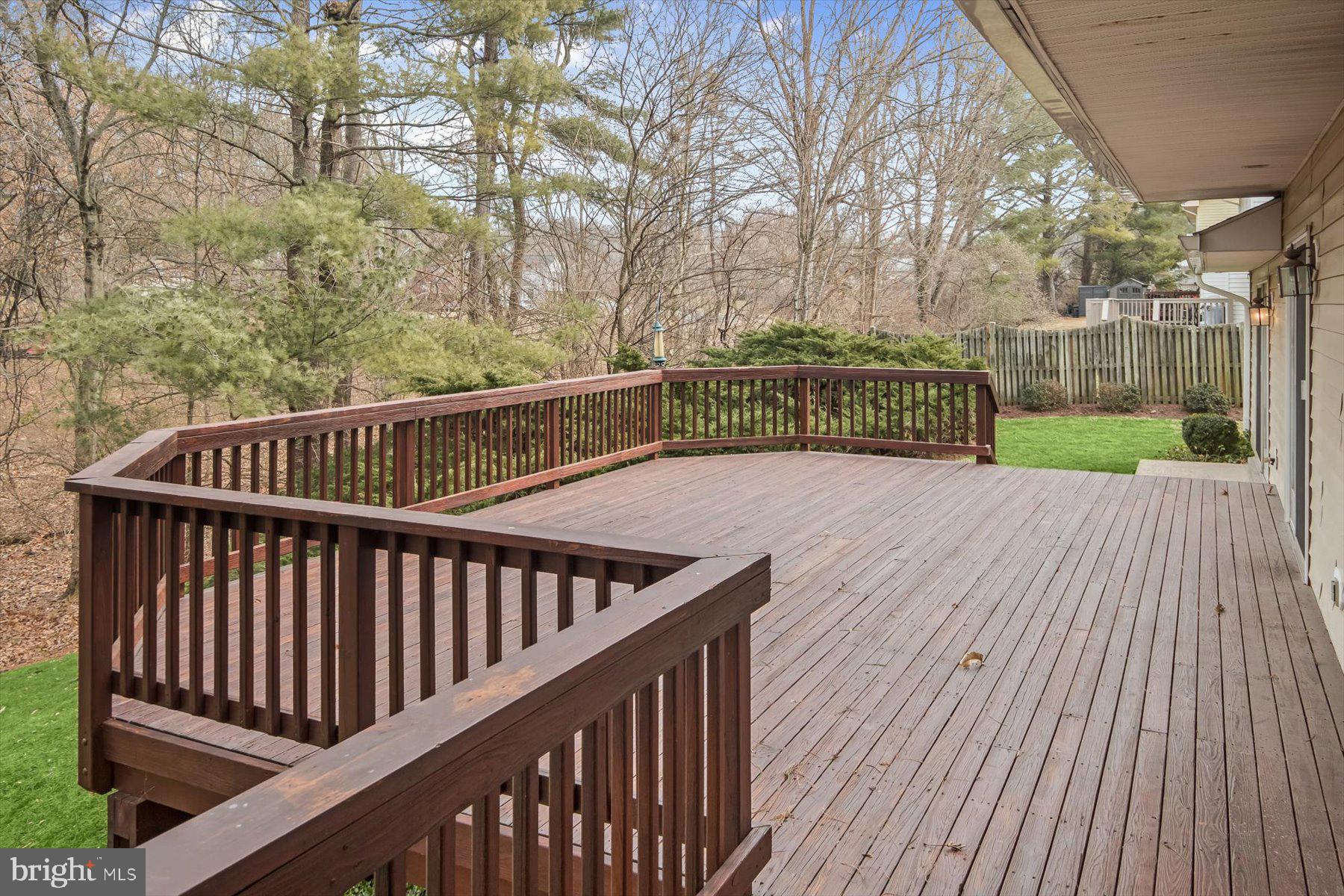 1727 Glastonberry Road Potomac, MD 20854 - Photo 19 of 45 a view of deck with wooden floor and fence with a bench