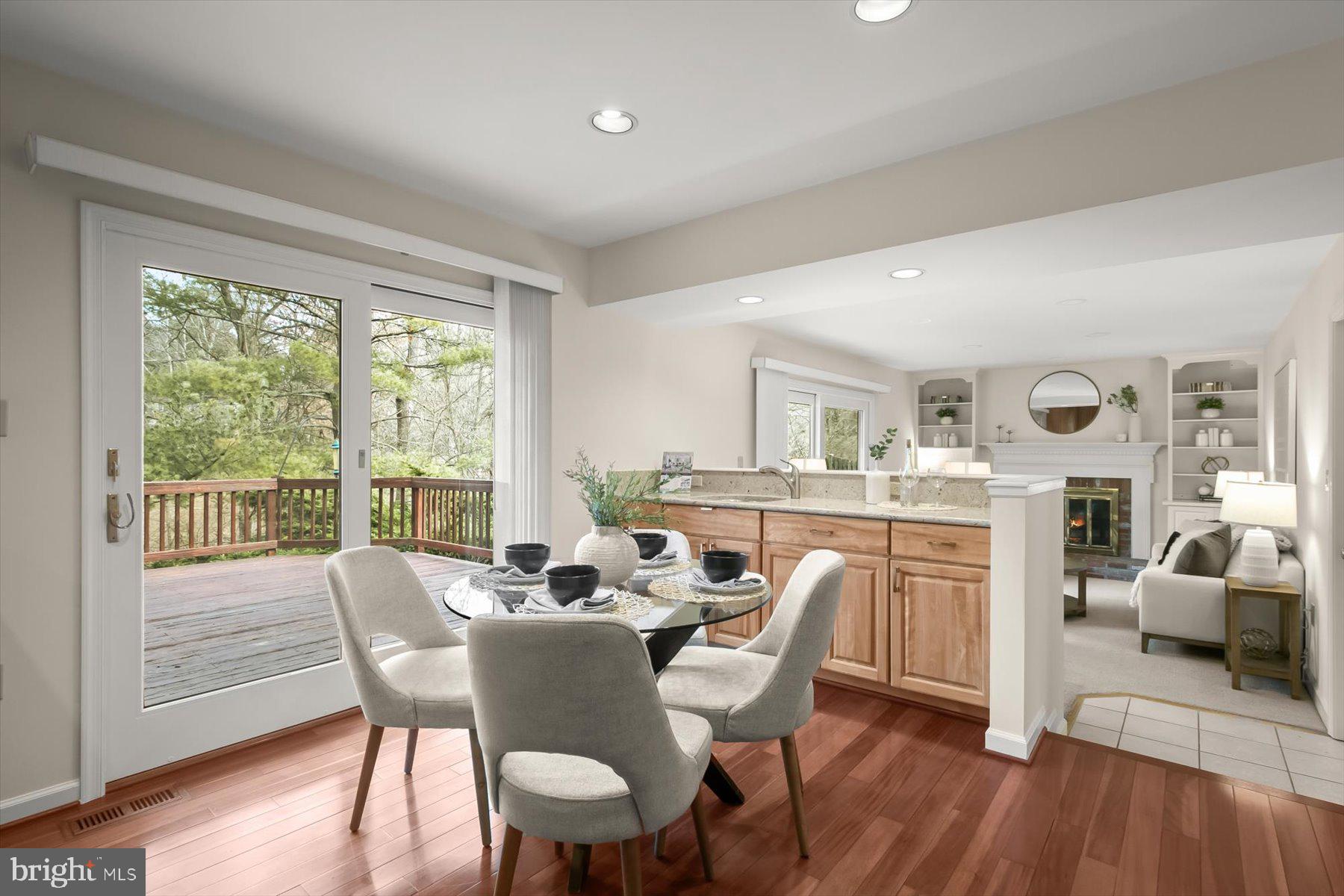 1727 Glastonberry Road Potomac, MD 20854 - Photo 21 of 45 a view of a dining room with furniture window and wooden floor