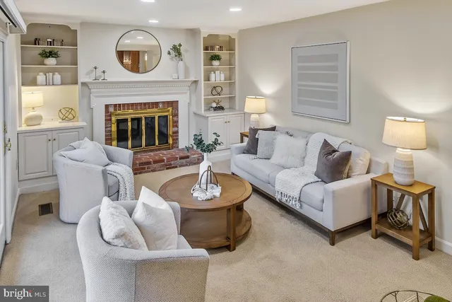a bathroom with a sink mirror and toilet