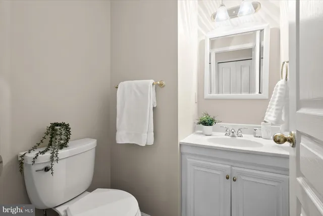 a spacious bedroom with a bed and a chandelier