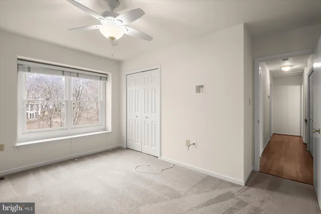 a bathroom with a sink a toilet and shower curtain