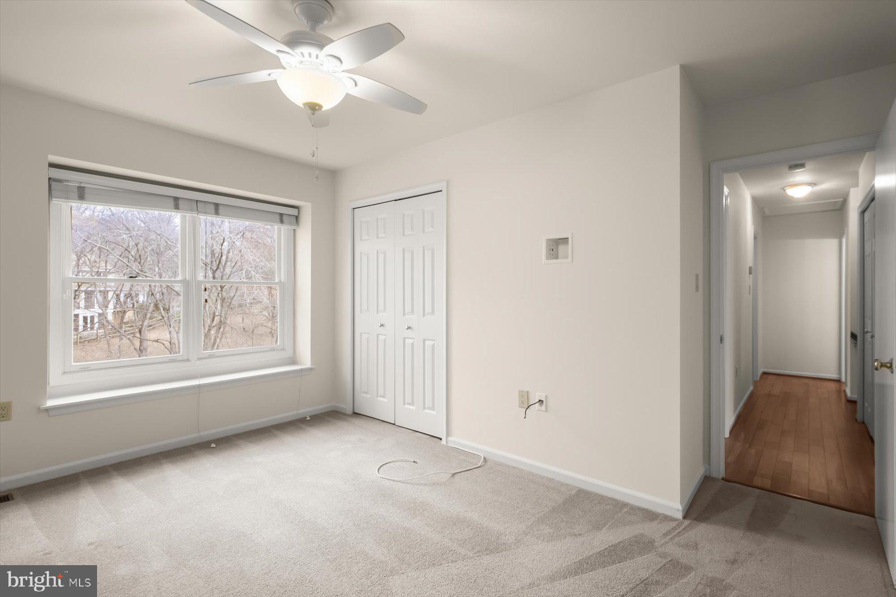 1727 Glastonberry Road Potomac, MD 20854 - Photo 32 of 45 a view of a big room with windows and chandelier fan
