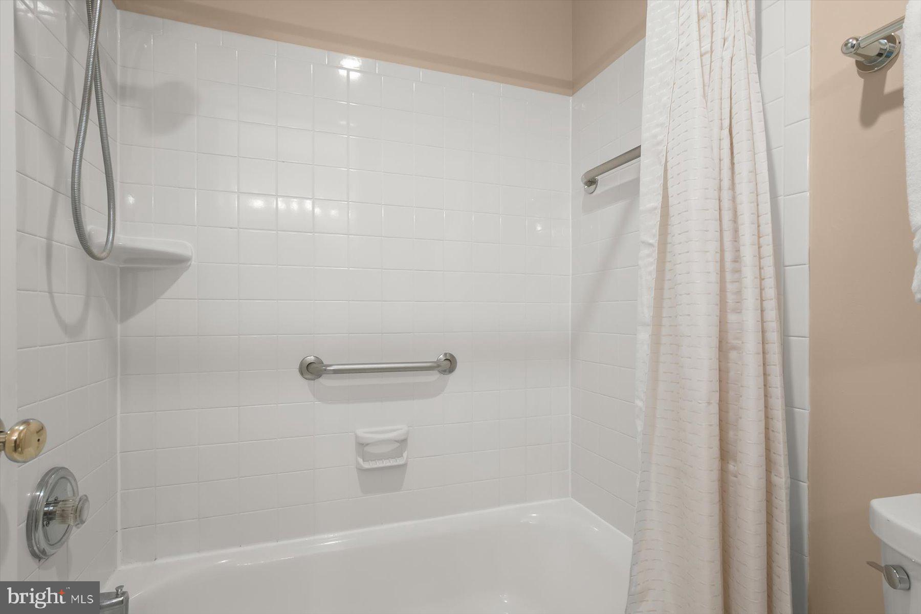 1727 Glastonberry Road Potomac, MD 20854 - Photo 35 of 45 a bathroom with a shower and a toilet