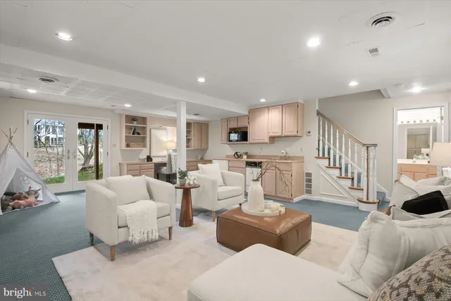 a kitchen with white cabinets and a sink