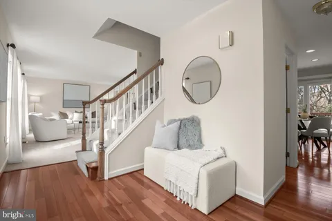 a view of entryway with wooden floor and stairs