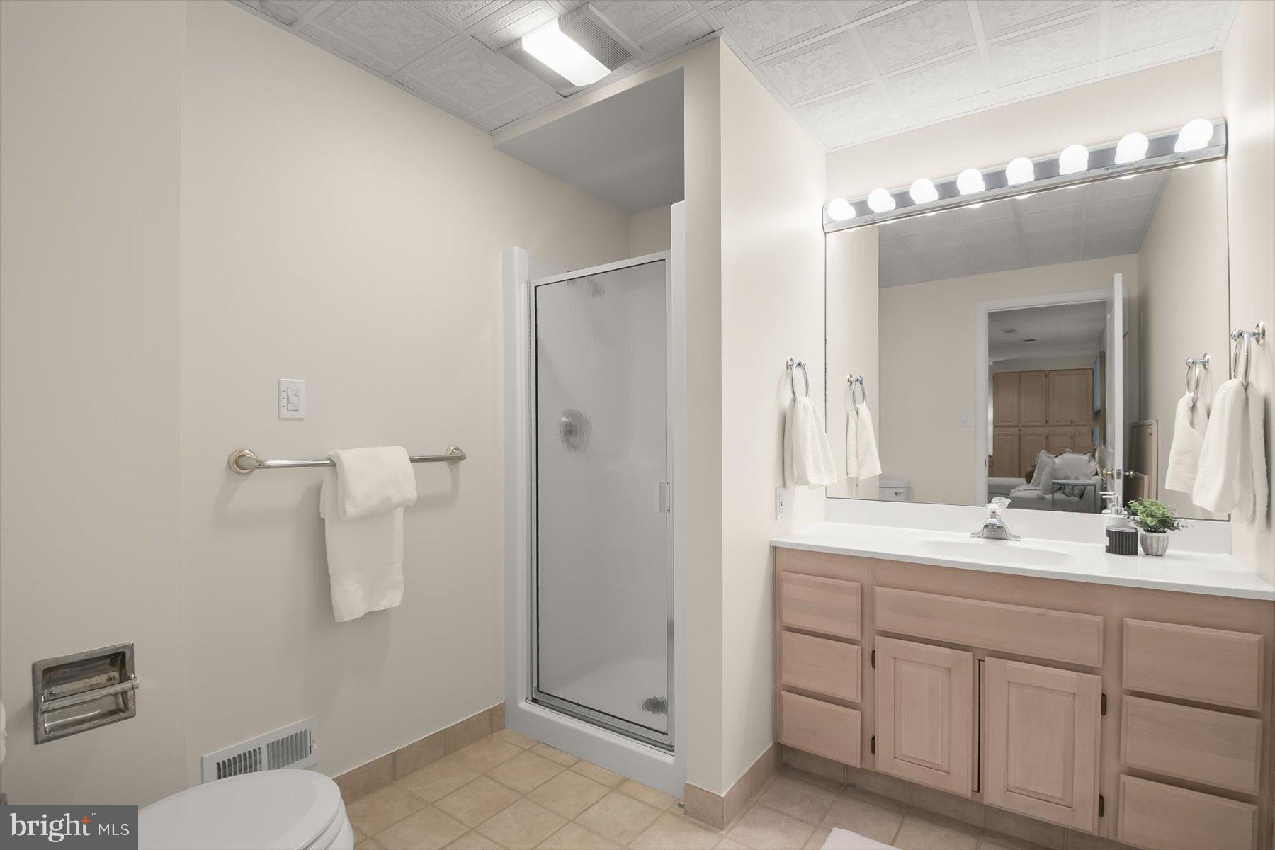 1727 Glastonberry Road Potomac, MD 20854 - Photo 42 of 45 a bathroom with a double vanity sink mirror and toilet