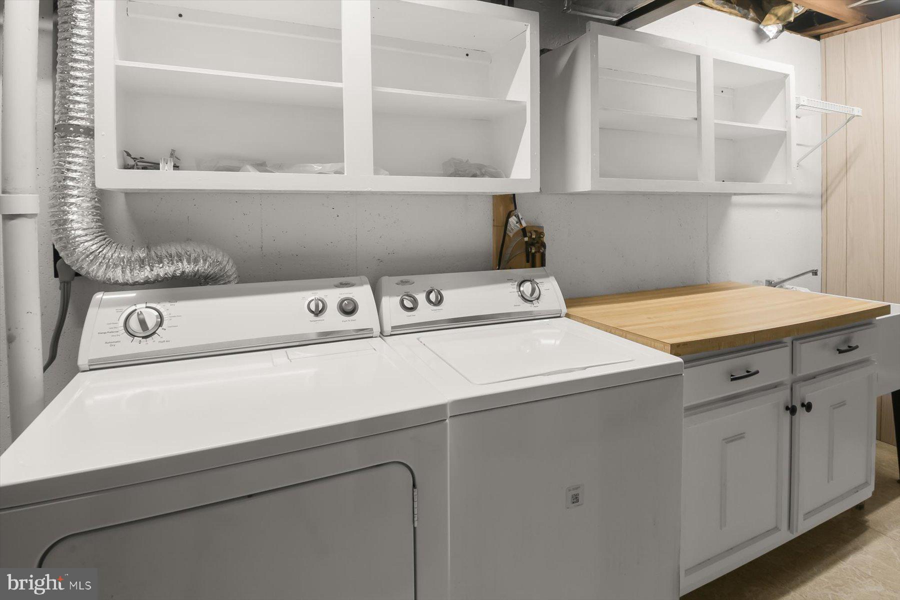 1727 Glastonberry Road Potomac, MD 20854 - Photo 43 of 45 a utility room with dryer and washer