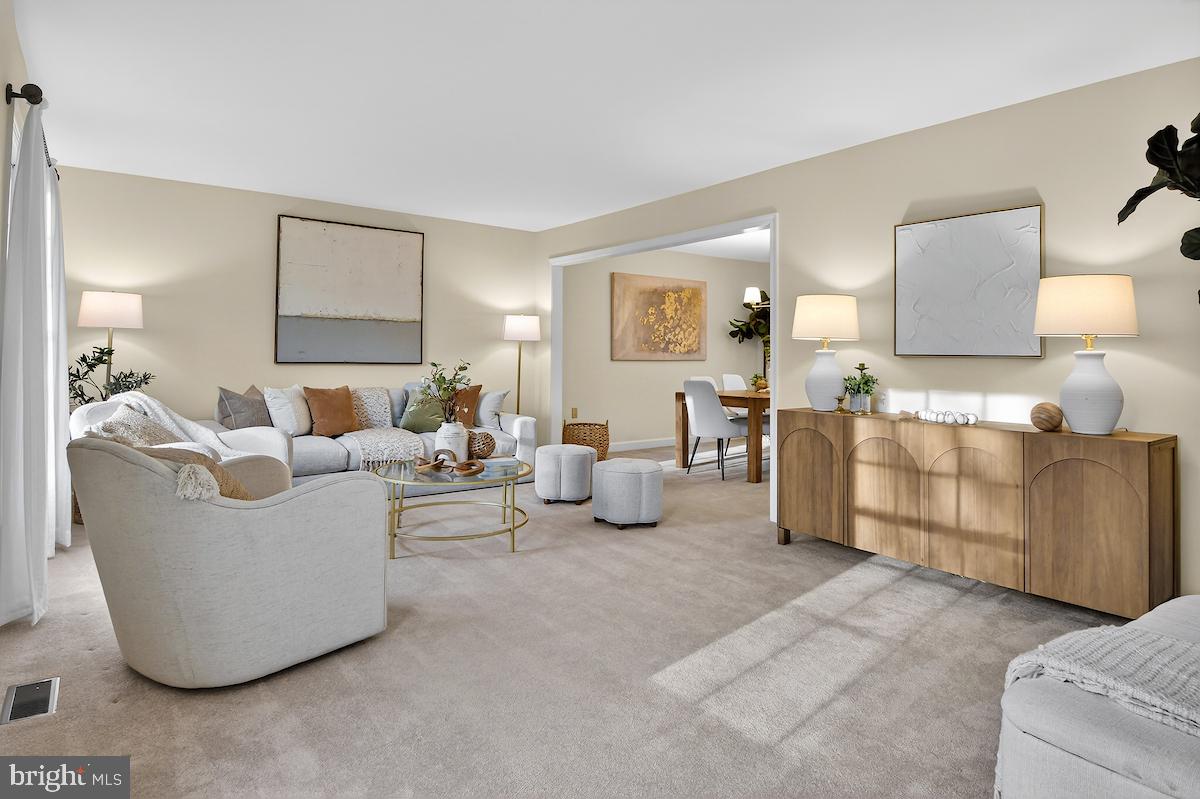 1727 Glastonberry Road Potomac, MD 20854 - Photo 6 of 45 a living room with furniture and a lamp