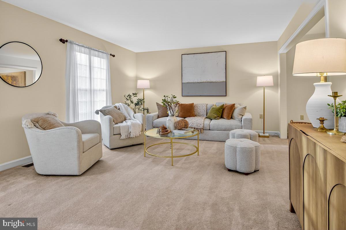 1727 Glastonberry Road Potomac, MD 20854 - Photo 7 of 45 a living room with furniture and a large window
