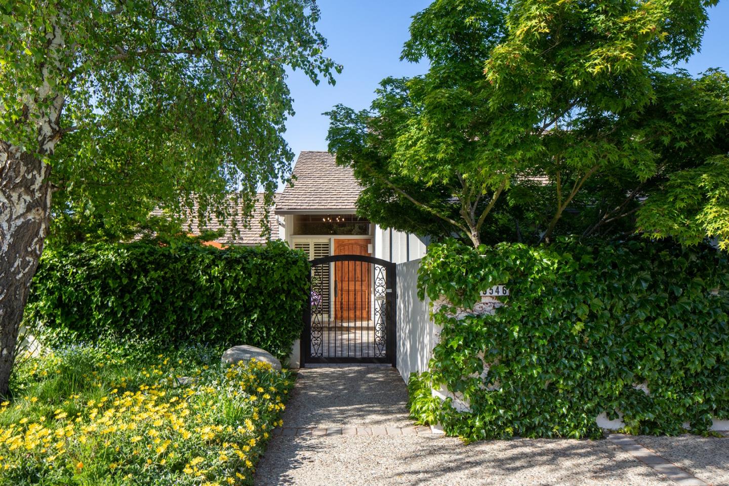 9546 Maple Court Carmel, CA 93923 - Photo 3 of 27 a front view of a house with a yard