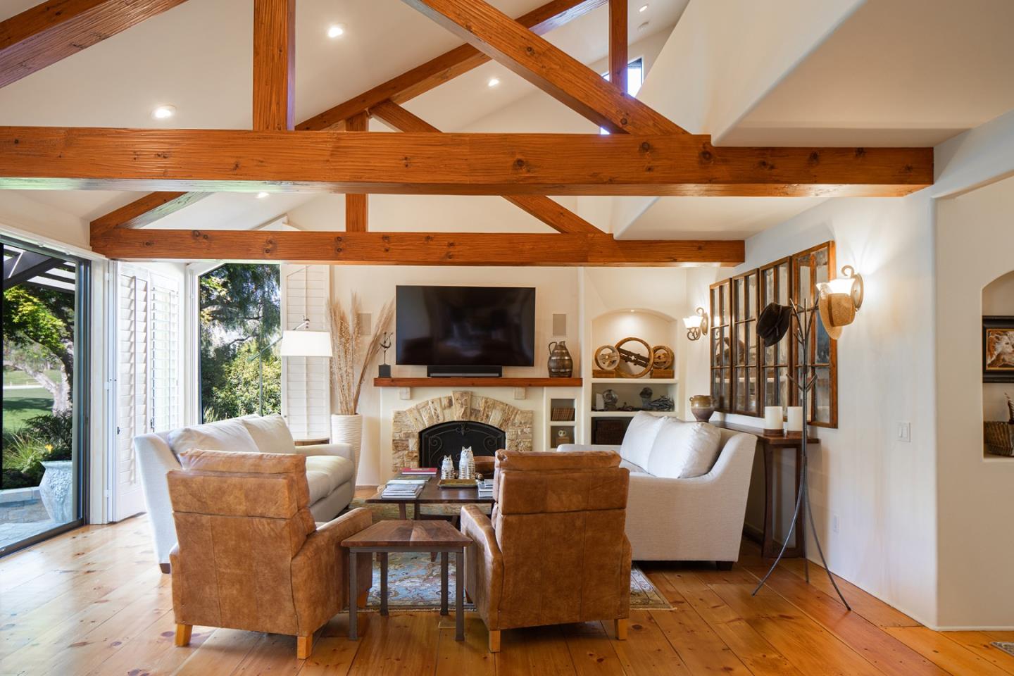 9546 Maple Court Carmel, CA 93923 - Photo 10 of 27 a living room with furniture fireplace and a flat screen tv