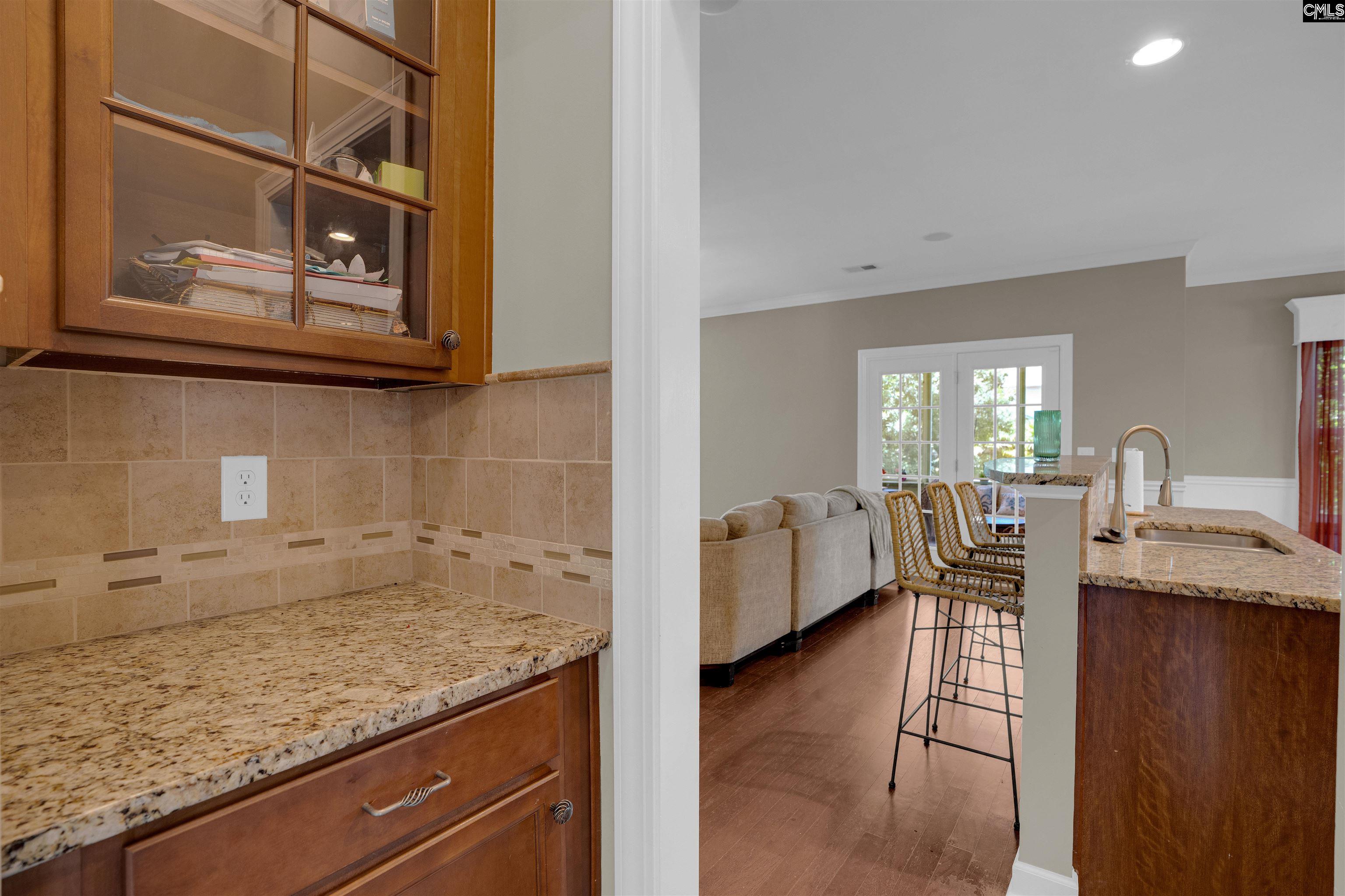 321 Asa Rose Lexington, SC 29072 - Photo 9 of 52 a view of a kitchen area with furniture and wooden floor