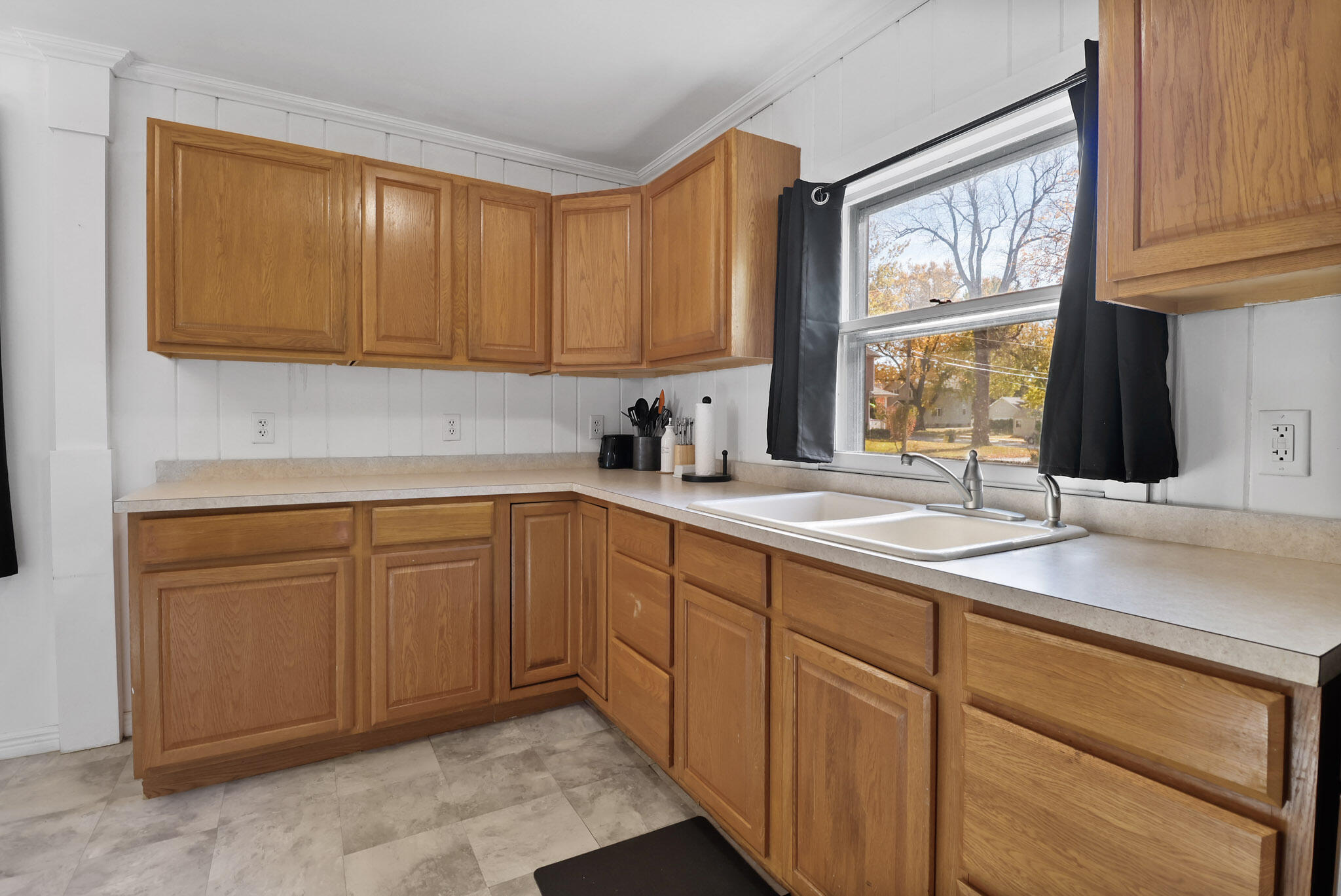 607 Madison Street Valparaiso, IN 46385 - Photo 9 of 15 a kitchen with sink cabinets and window