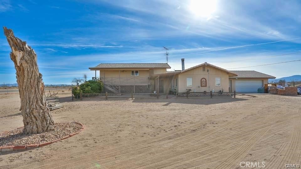 11954 Topaz Road Victorville, CA 92392 - Photo 1 of 1 a front view of a house with a yard