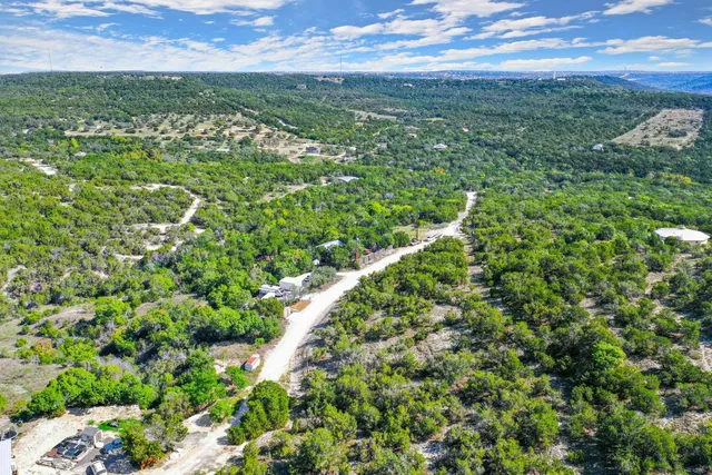 a view of a lush green space with sea