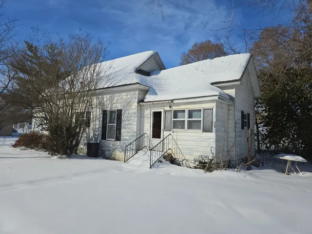 a front view of a house with a outdoor space