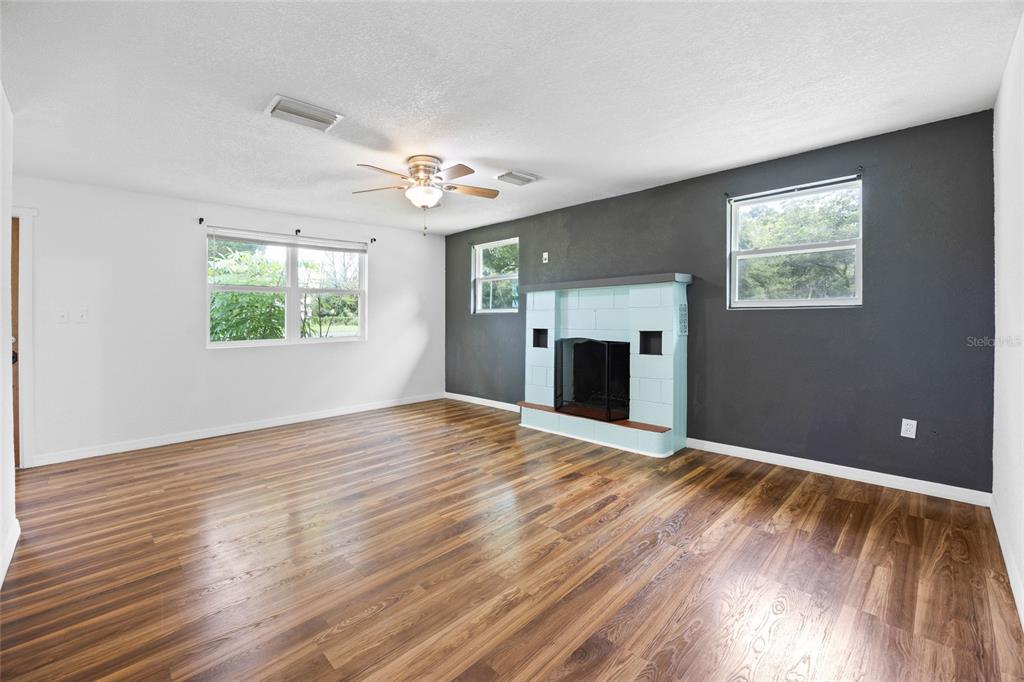 3157 Highway 41 Dunnellon, FL 34432 - Photo 11 of 38 a view of an empty room with a window and wooden floor