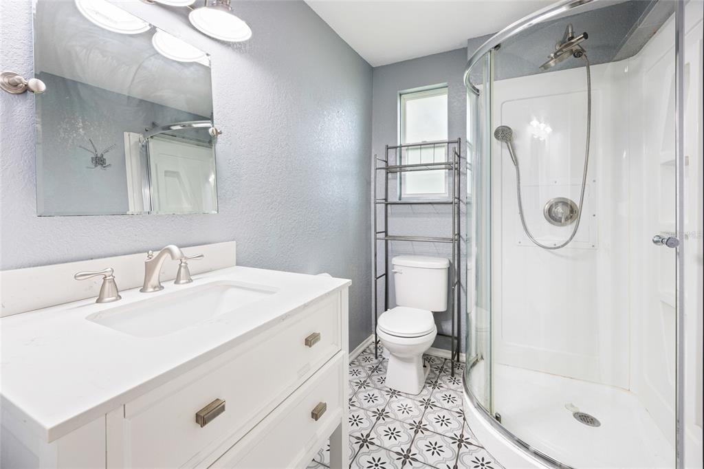 3157 Highway 41 Dunnellon, FL 34432 - Photo 22 of 38 a bathroom with a sink a toilet and shower