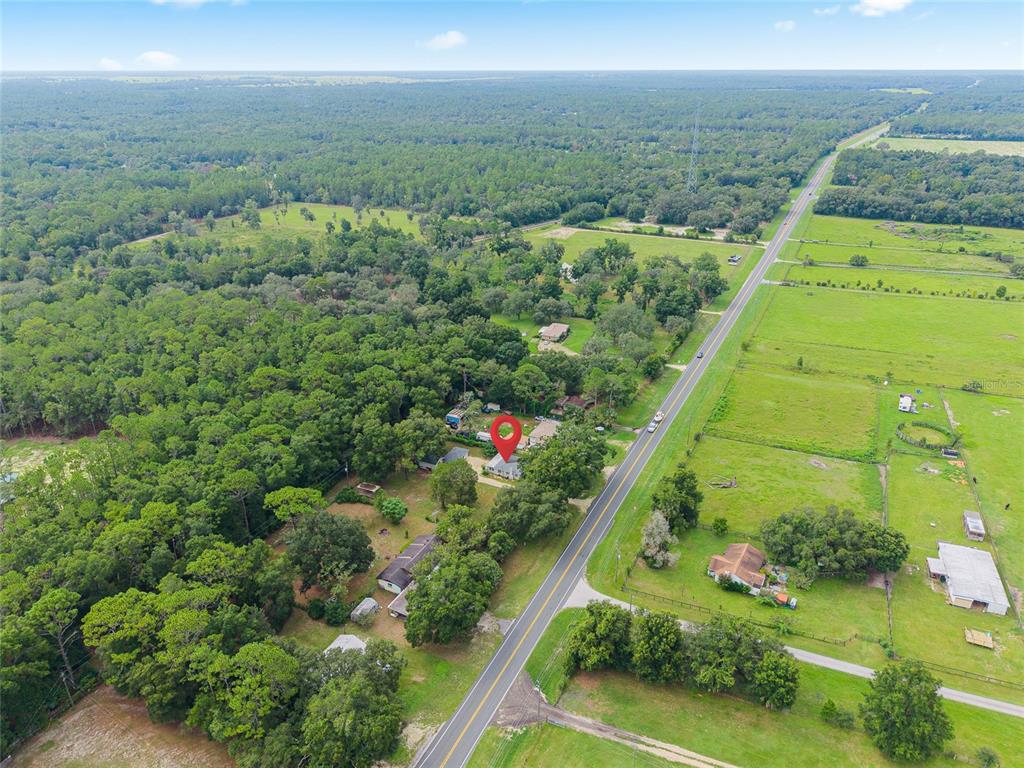 3157 Highway 41 Dunnellon, FL 34432 - Photo 3 of 38 an aerial view of residential houses with outdoor space and street view