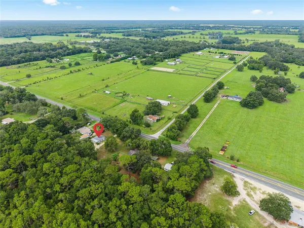 a view of a field with an ocean